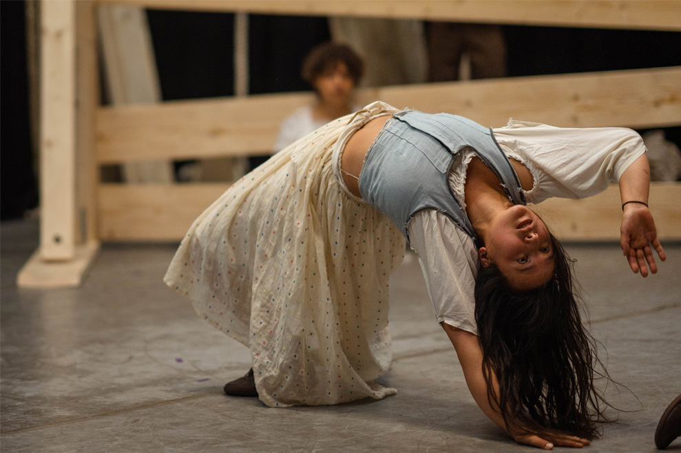 Rehearsal photography. Tess performer exhibits a backbend.