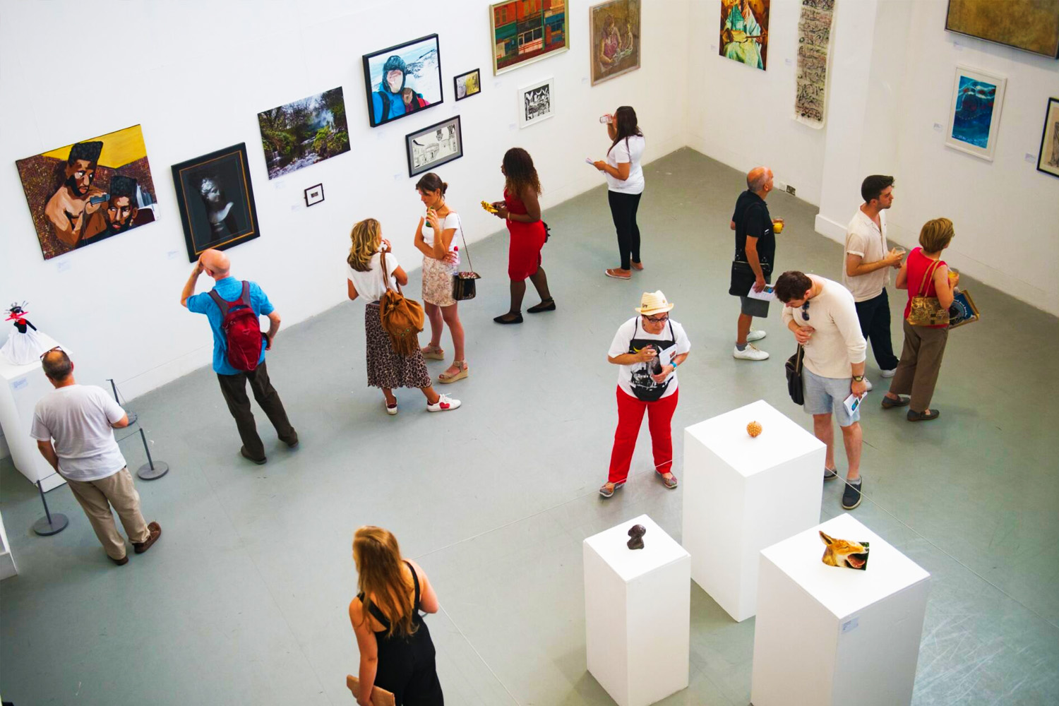 A birds-eye view of a busy art gallery exhibition at artsdepot.